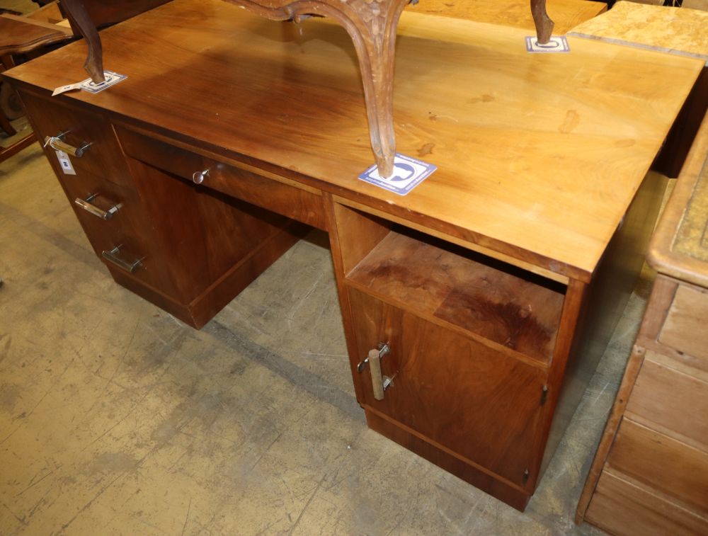 An Art Deco style chrome mounted walnut pedestal desk, W.150cm, D.75cm, H.75cm